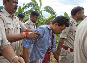 গেটম্যানকে আটক করে নিয়ে যাচ্ছে পুলিশ